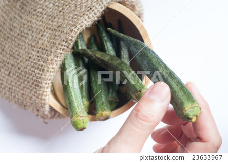 Healthy okra chips on clean background Healthy okra chips on clean background 23633967