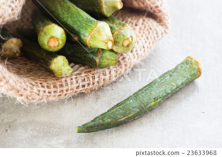 Healthy okra chips on clean background Healthy okra chips on clean background 23633968