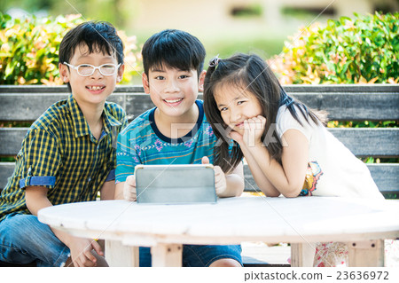 little asian girl and boy using digit little asian girl and boy using digit 23636972