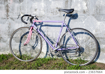 sports bike standing near wall 23637664