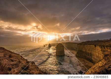 The sunset lightens the Australian Great Ocean Road's Twelve Apostles The sunset lightens the Australian Great Ocean Road's Twelve Apostles 23640665