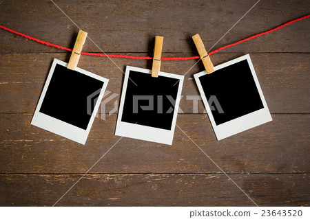 three blank photo frame hanging on wood background three blank photo frame hanging on wood background 23643520