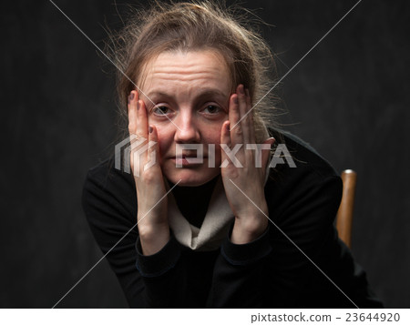 pale tired woman looking straight 23644920