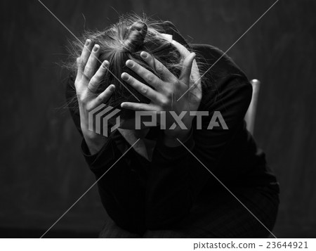 Portrait of a young sad woman Portrait of a young sad woman 23644921