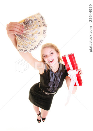 Woman holds christmas gift box and polish money. Holidays. 23644959