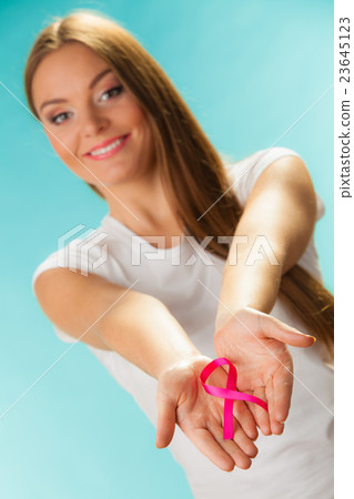 pink breast cancer awareness ribbon on womans hands pink breast cancer awareness ribbon on womans hands 23645123
