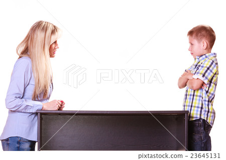 Mother and son talk and argue sit at table. Mother and son talk and argue sit at table. 23645131