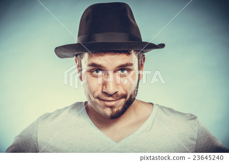 Happy man with half shaved face beard hair in hat. Happy man with half shaved face beard hair in hat. 23645240