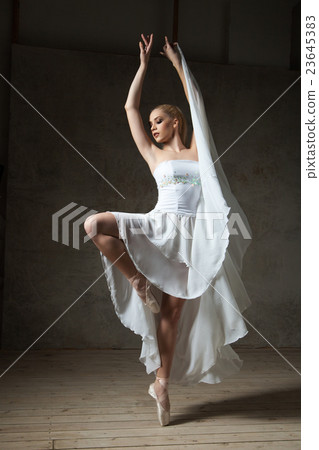 Beautiful ballerina dancing in white dress Beautiful ballerina dancing in white dress 23645383
