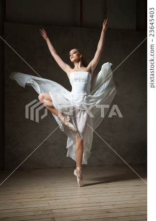 Beautiful ballerina dancing in white dress 23645403