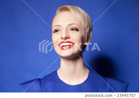 Happy blonde girl with short hair and red lips Happy blonde girl with short hair and red lips 23645787