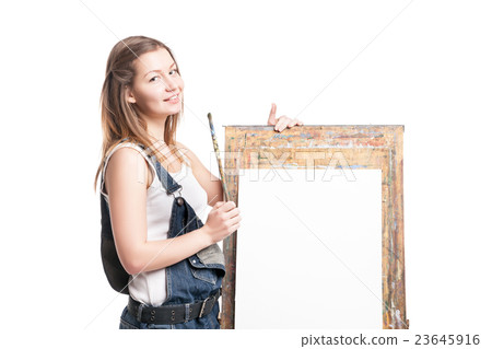 Young smiling woman painter with paintbrush 23645916