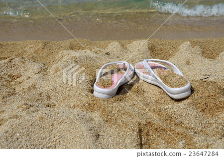 Flip-flops on Beach 23647284