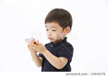 Infant operating a smartphone 23649376
