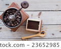 Coffee grinder on a wooden table . 23652985