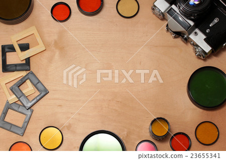 colored photo filters, camera and slides on wooden colored photo filters, camera and slides on wooden 23655341