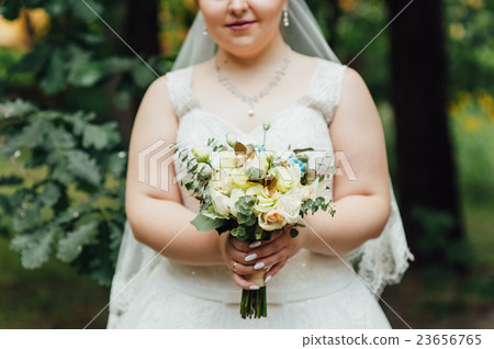 beautiful bouquet in hands of the very fat bride beautiful bouquet in hands of the very fat bride 23656765