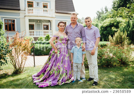 Portrait of Happy Family In Park - outdoor shot Portrait of Happy Family In Park - outdoor shot 23658589