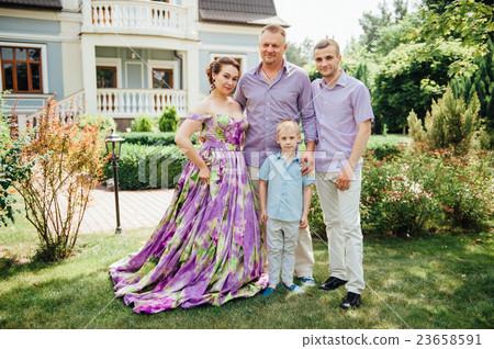 Portrait of Happy Family In Park - outdoor shot Portrait of Happy Family In Park - outdoor shot 23658591