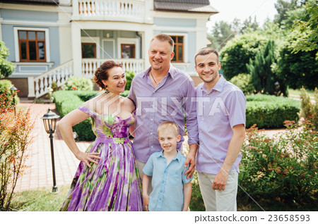 Portrait of Happy Family In Park - outdoor shot Portrait of Happy Family In Park - outdoor shot 23658593