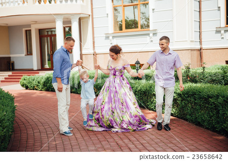 Portrait of Happy Family In Park - outdoor shot Portrait of Happy Family In Park - outdoor shot 23658642