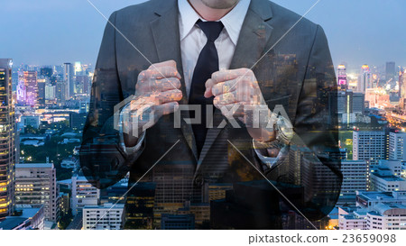 man holding his fists with cityscape man holding his fists with cityscape 23659098
