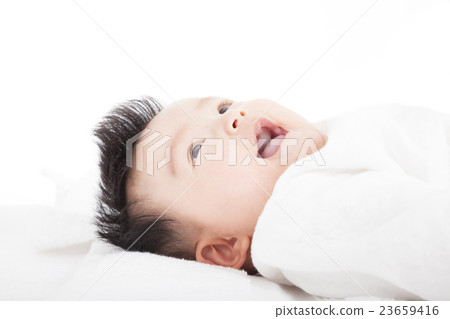 Baby having laughing and lying  on the towel 23659416