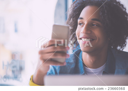 Young confident man answering call 23660368