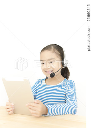 Girls talking with tablets and headsets 23660843