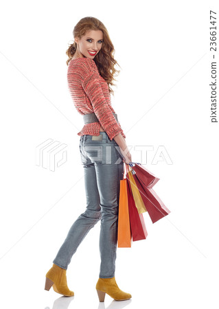 woman with shopping bags. Studio shoot 23661477