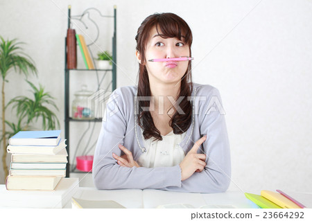 A girl studying the examination exam 23664292