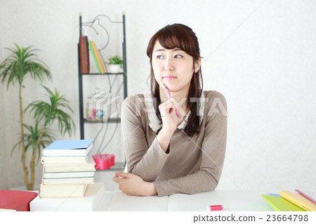 A girl studying the examination exam 23664798