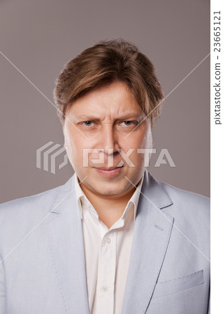 Angry Frowning Middle Age Man in Blue Jacket Angry Frowning Middle Age Man in Blue Jacket 23665121