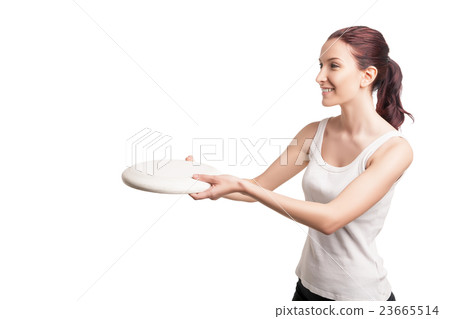 young happy woman playing with flying disc 23665514