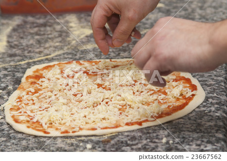 Man chef with raw pizza. 23667562