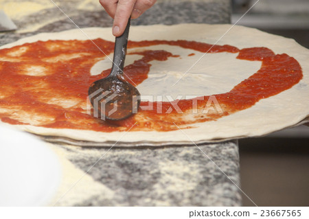 Man chef with raw pizza. 23667565