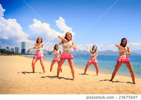 cheerleaders dance crossing arms on beach cheerleaders dance crossing arms on beach 23675697