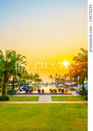 Beautiful Silhouette palm tree with umbrella and chair Beautiful Silhouette palm tree with umbrella and chair 23678283