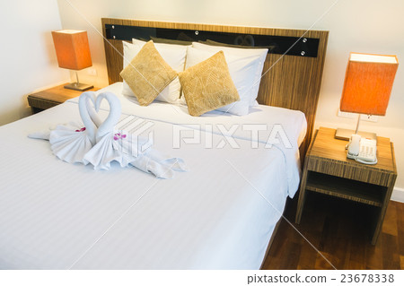 Pillow on bed 23678338