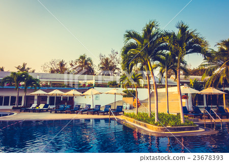 Beautiful Silhouette palm tree with umbrella and chair 23678393