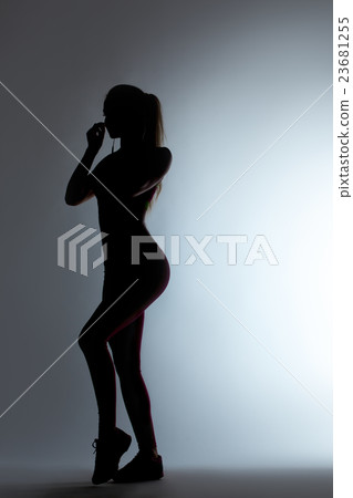 Woman walking black silhouette on gray background 23681255