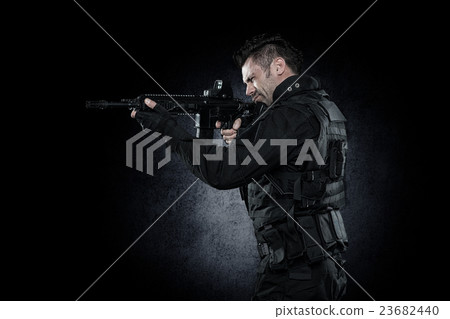 Three soldiers in full uniform with guns is going Three soldiers in full uniform with guns is going 23682440