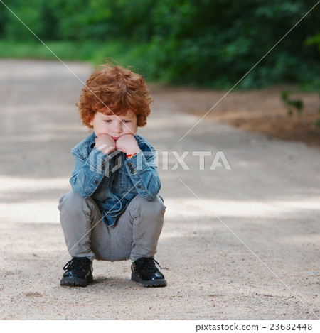 cute little emotional boy outdoors 23682448