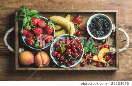 Summer fresh fruit and berry variety in rustic 23683076