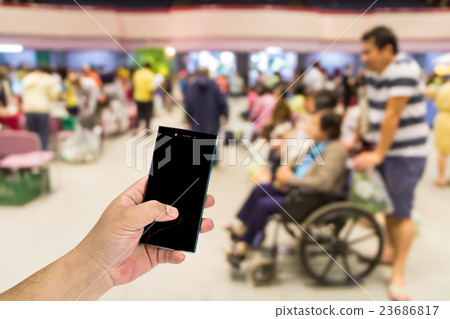 Mobile phone in hand on out-patient department 23686817