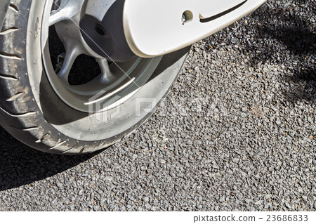 close up of motorcycle wheel, selective focus close up of motorcycle wheel, selective focus 23686833
