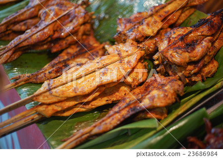 local grilled chicken on green leaf in thailand 23686984