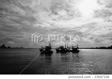 silhouette of three fishing boat laying on the sea 23687190