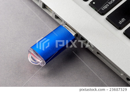 USB Flash drive on computer laptop keyboard USB Flash drive on computer laptop keyboard 23687329