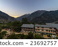 A small town village at top of hill.  23692757